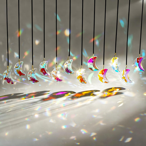 H&D HYALINE & DORA crystal suncatcher close-up catching sunlight with vivid prism glow.