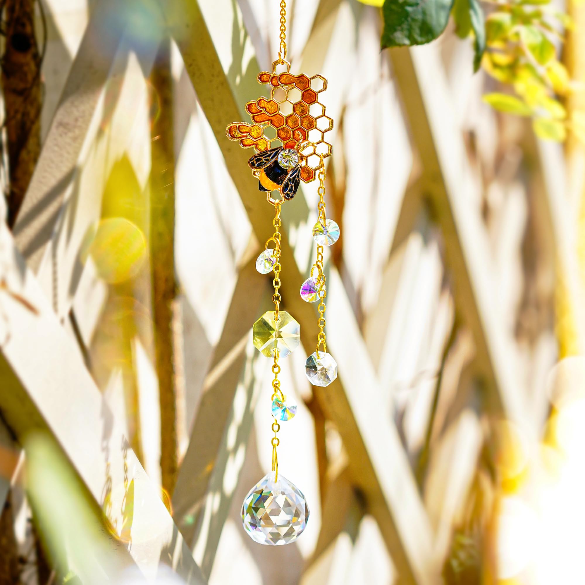 H&D HYALINE & DORA crystal bee suncatcher with metal bee accent catches daylight.