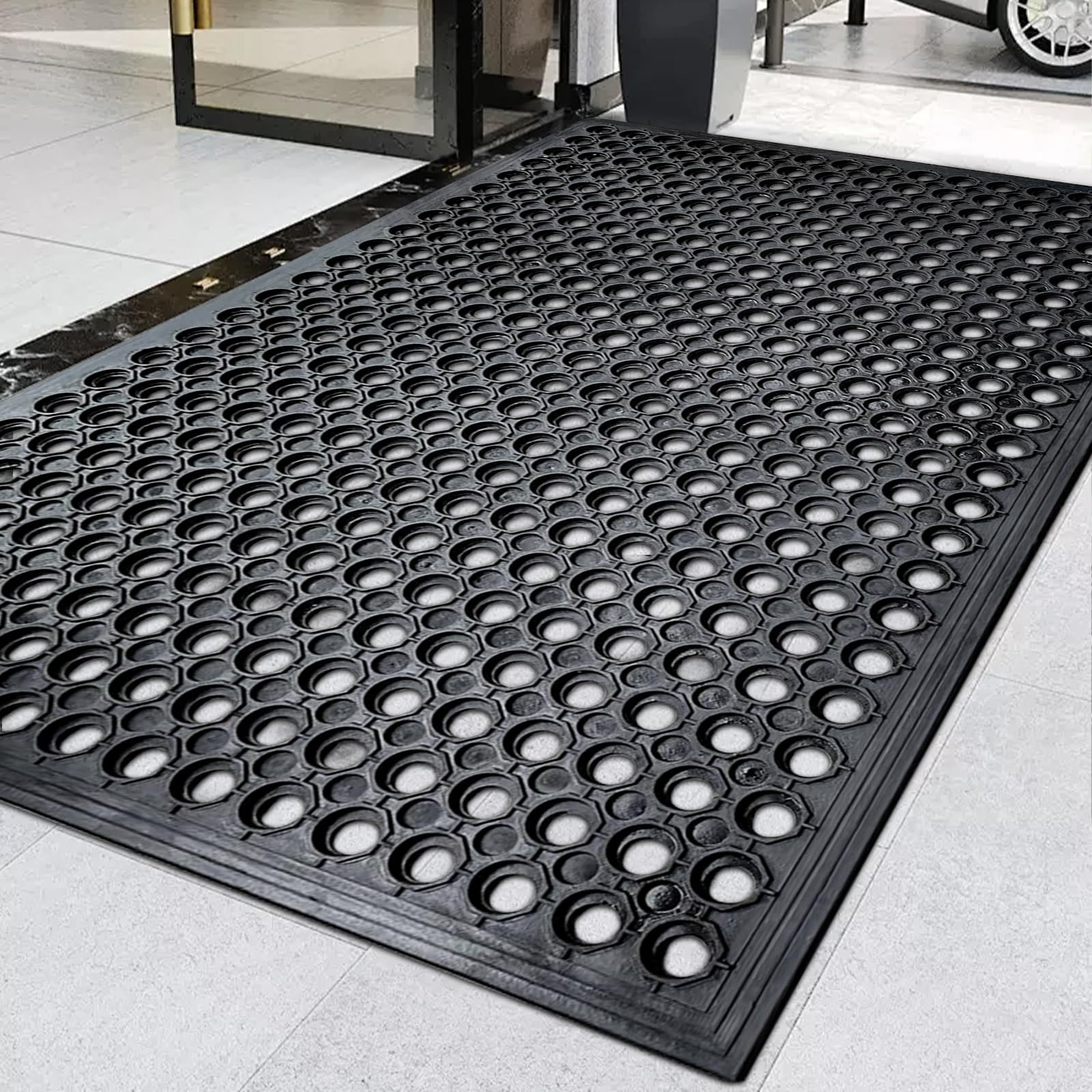 Halidec outdoor rubber mat with drainage holes improves wet area safety.
