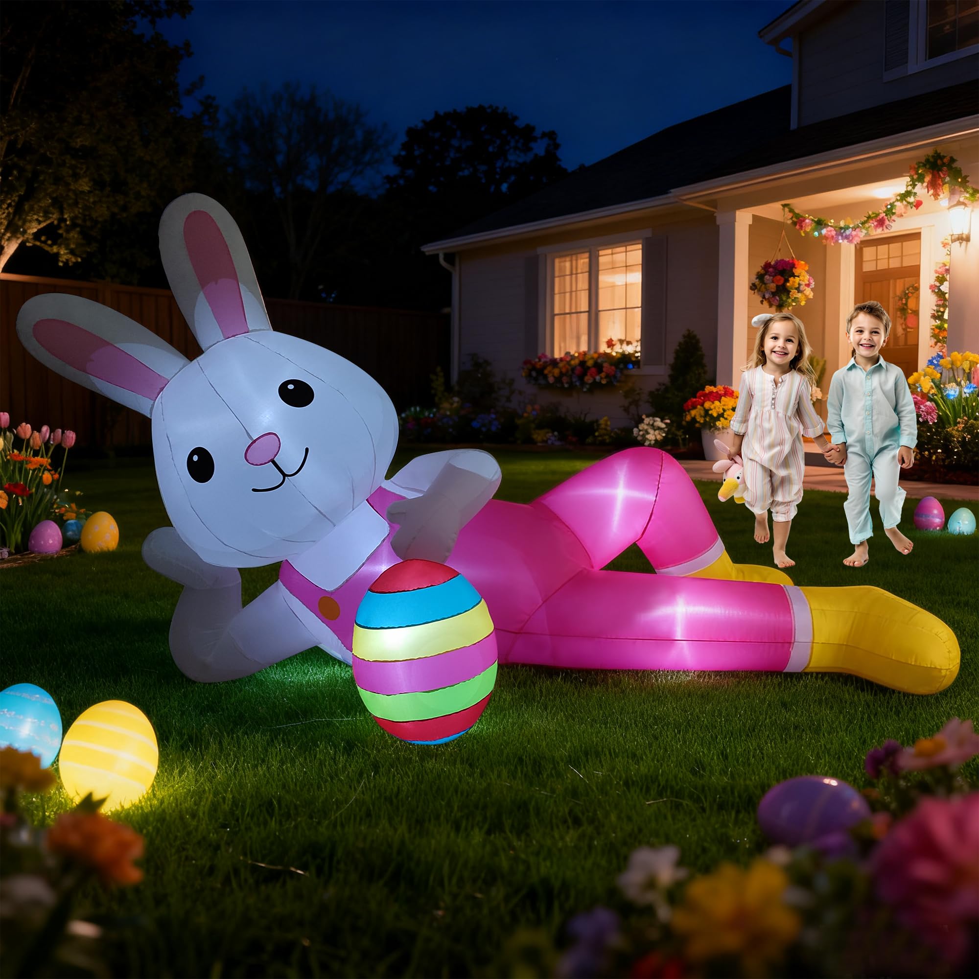 Hamito 12ft giant Easter bunny inflatable lying for a striking outdoor display at night with LED glow.