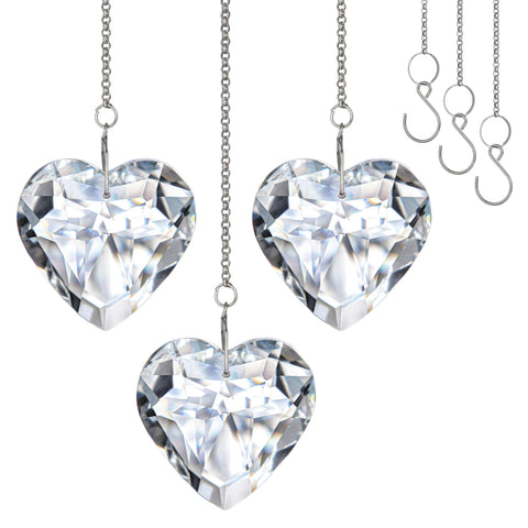H&D Hyaline & Dora clear crystal heart suncatchers casting vivid rainbows in sunny windows