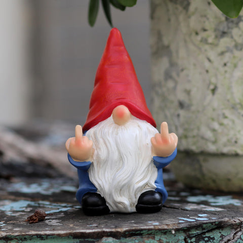 Hand-painted gnome sculpture with detailed accents for a vintage vibe.