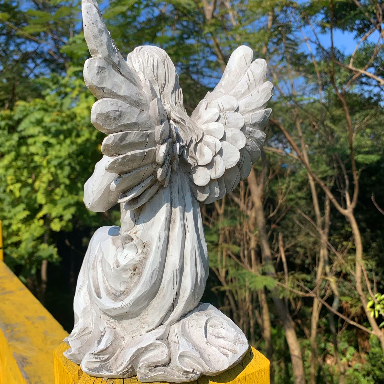 Handsider christian garden art angel enhances traditional outdoor spaces.