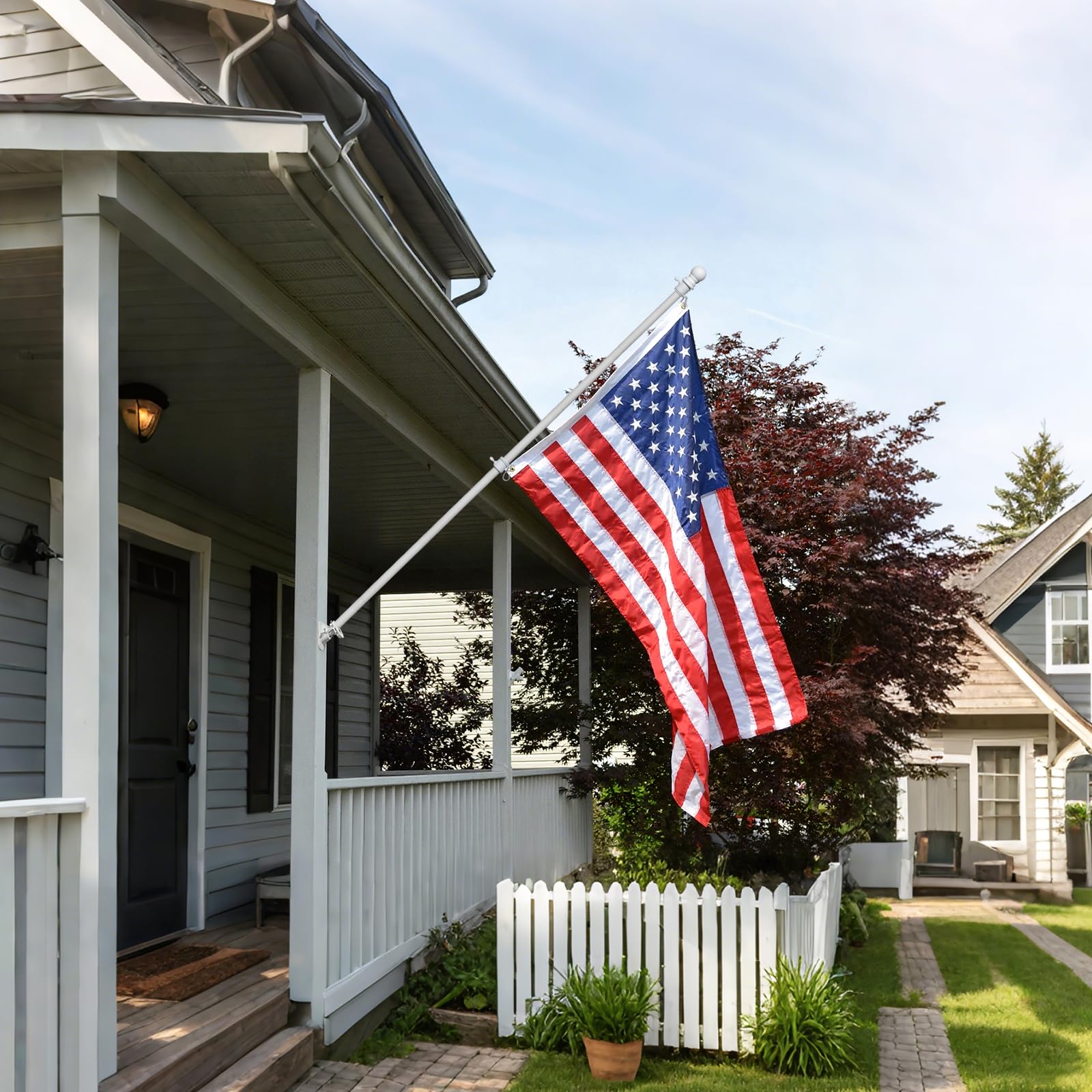 Hangmaicome flag display on porch or brick wall enhances curb appeal