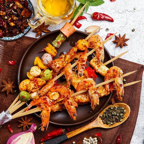 Assorted foods on HANSGO skewers for lamb kebabs and fruit