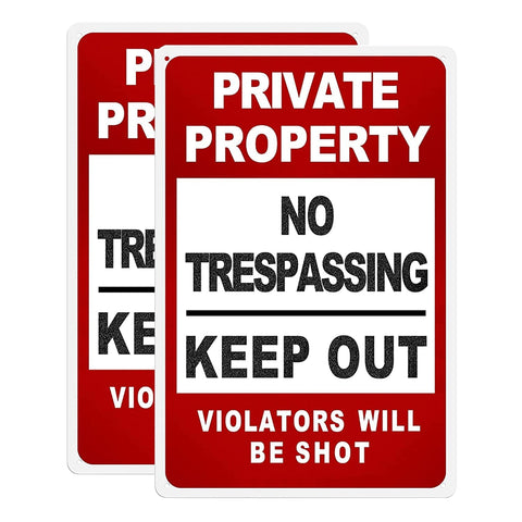 HANTAJANSS no trespassing yard guard sign 2-pack on a wooden fence for property protection.