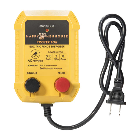 Happy Henhouse electric fence charger installed on fence post to protect free-range chickens.
