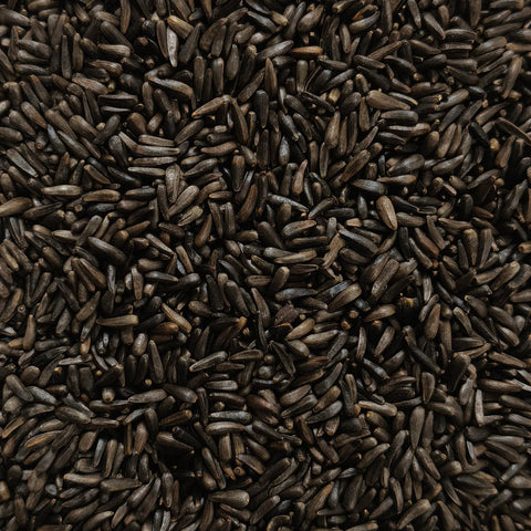 Happy Wings Nyjer seeds ready to feed birds in a 12-inch sock.