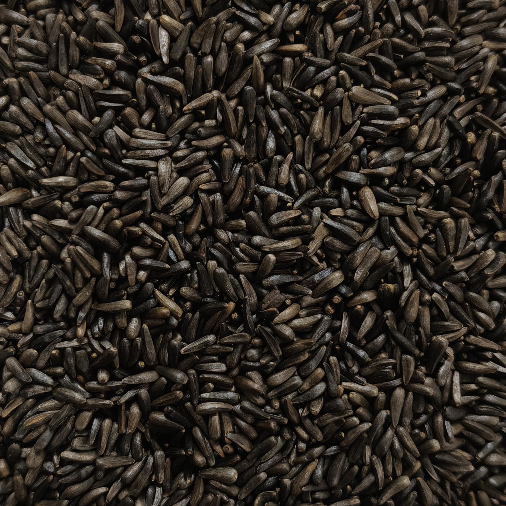 Happy Wings Nyjer seeds product packaging with brand and certifications