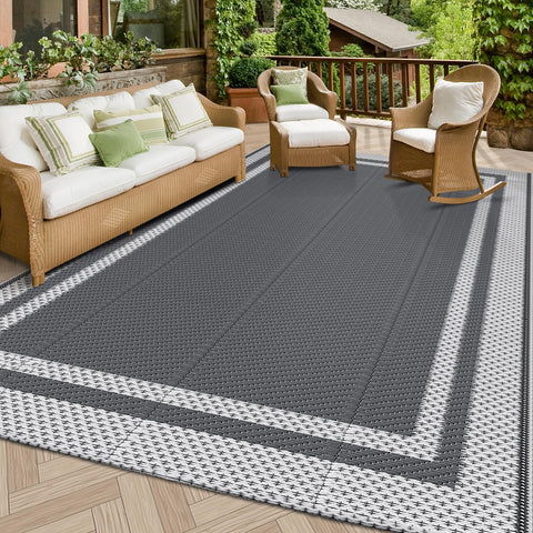 HappyTrends outdoor rug laid flat on a sunny patio, waterproof and easy to clean.