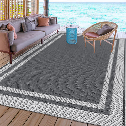 HappyTrends waterproof rug resists rain and splashes near RV.