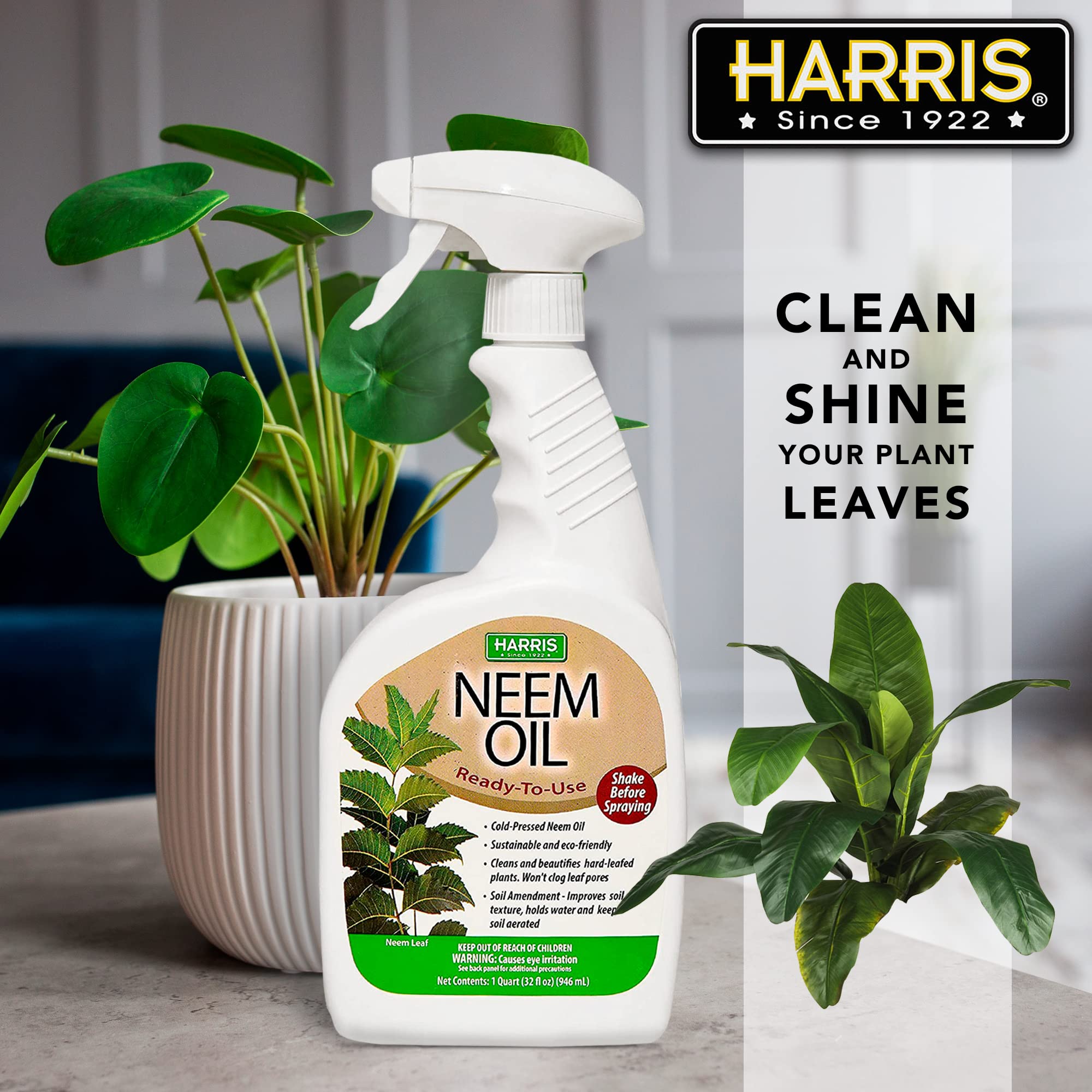 HARRIS Neem Oil Spray being applied on outdoor plants for broad coverage.