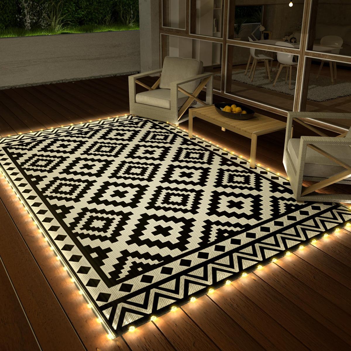 Haushof outdoor rug with LED strip lights around edge for ambient evenings.