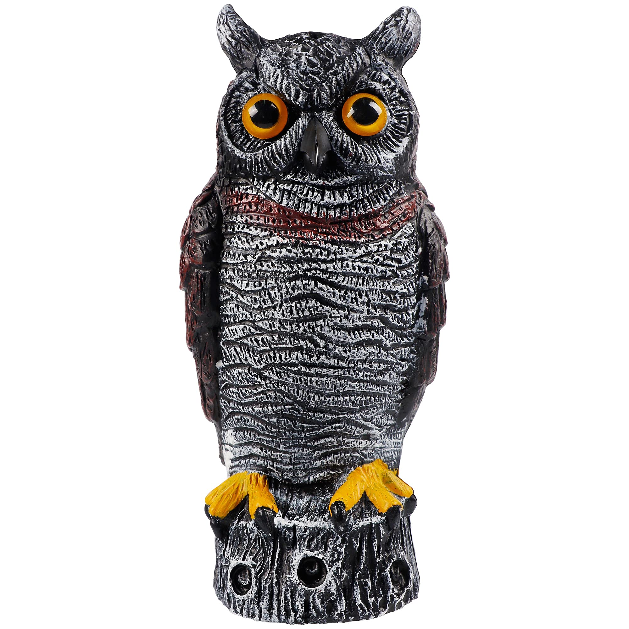 Hausse horned owl decoy in a garden to deter birds.