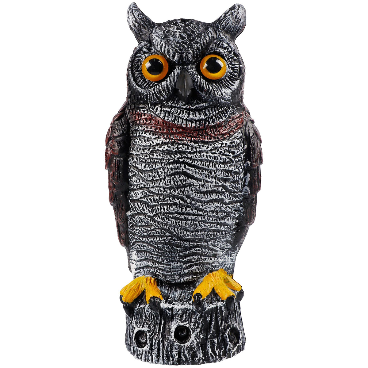 Hausse horned owl decoy in a garden to deter birds.