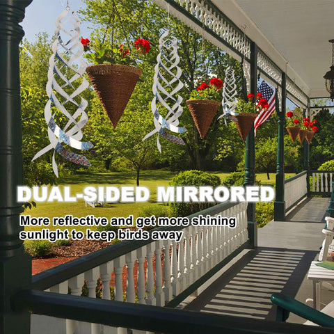 Hausse silver Mylar spinner hangs to protect fruit trees from pigeons and geese.