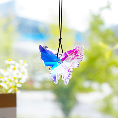 HD Haline Dora rainbow butterfly sun catcher reflects sunbeams in windows.