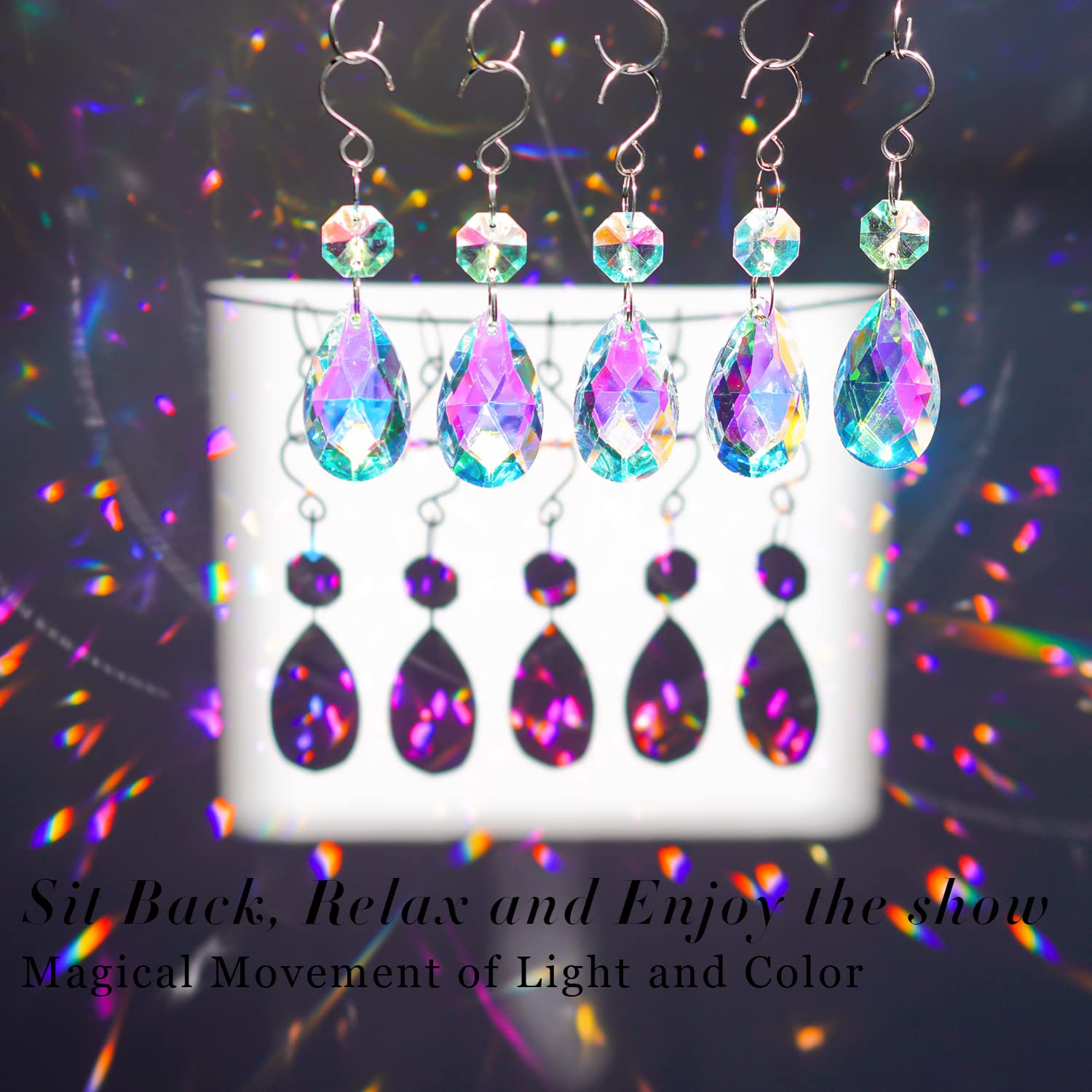 H&D HYALINE & DORA AB-color teardrop prism reflects rainbow light on walls.