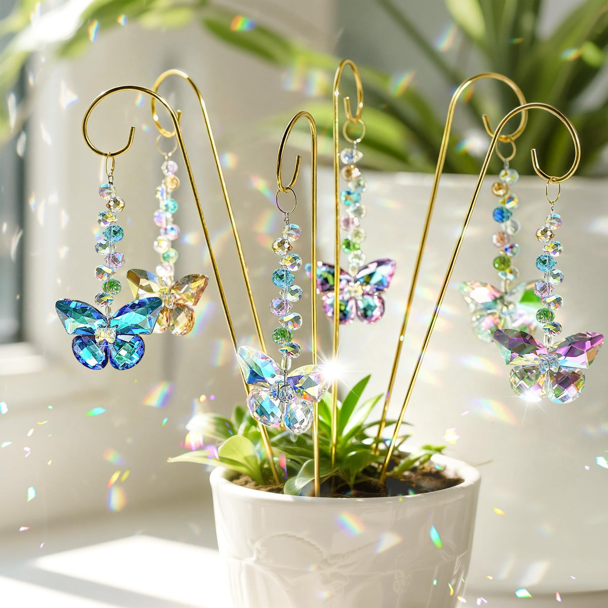 H&D HYALINE & DORA butterfly crystal suncatcher stake captures sunlight to create rainbow prisms.
