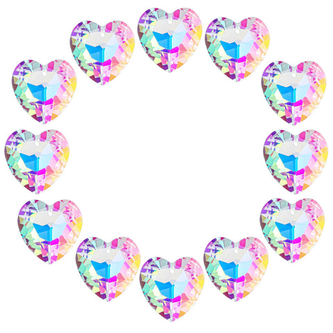 H&D HYALINE & DORA crystal heart suncatcher catching sunlight to cast tiny rainbows.