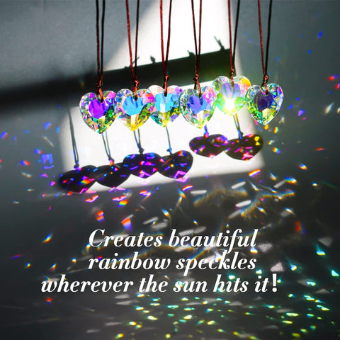 H&D HYALINE & DORA crystal heart prism in sunlight creating dancing light across walls.