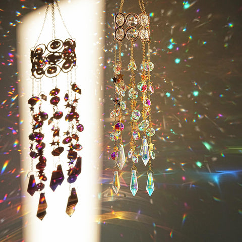 H&D HYALINE & DORA crystal suncatcher shining in sunlight with rainbow reflections