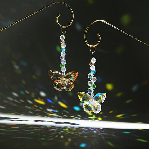 H&D HYALINE & DORA golden trellis plant support frames climbing vines while showcasing the suncatcher.