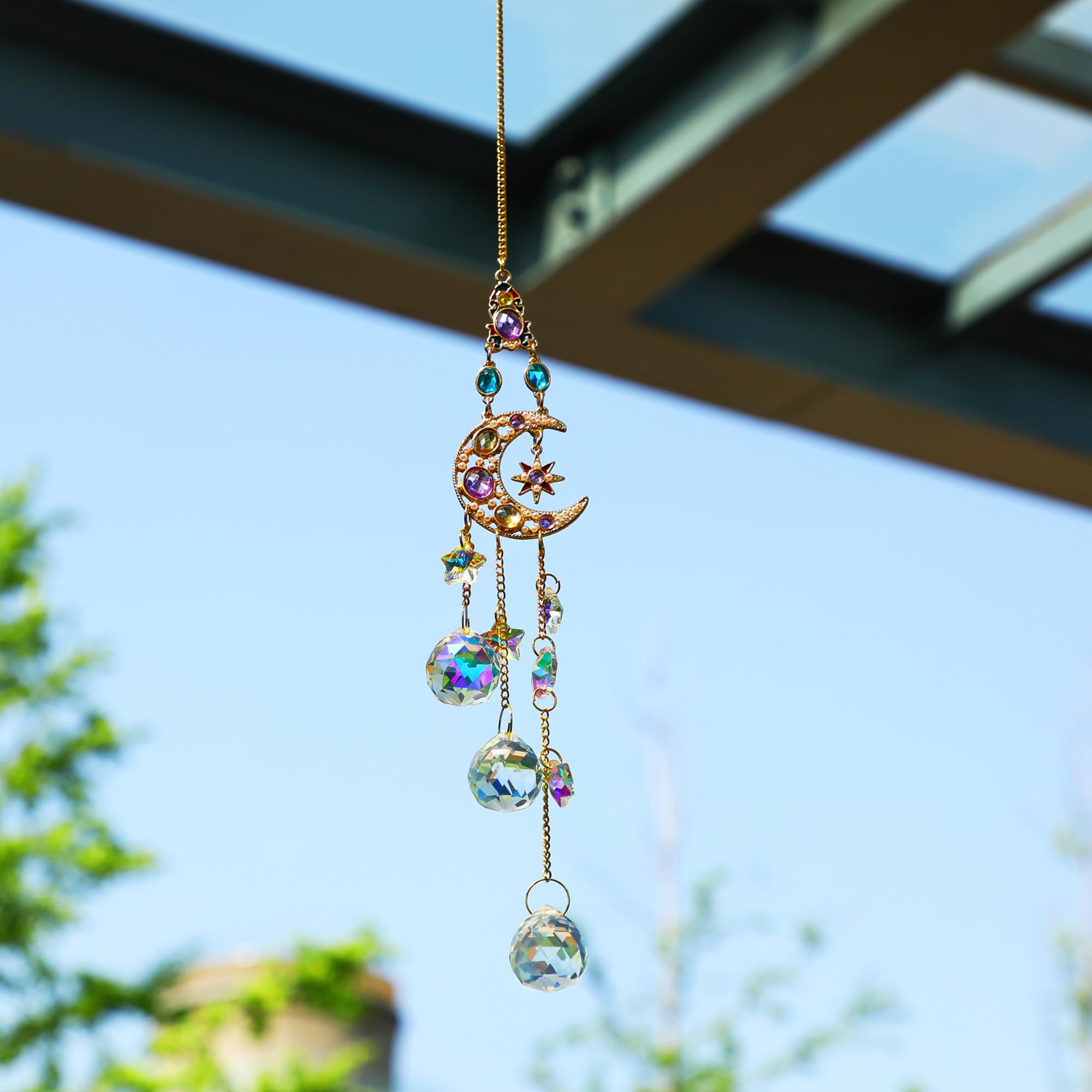 H&D Hyaline & Dora moon-star prism suncatcher adds celestial sparkle to doors and porches.