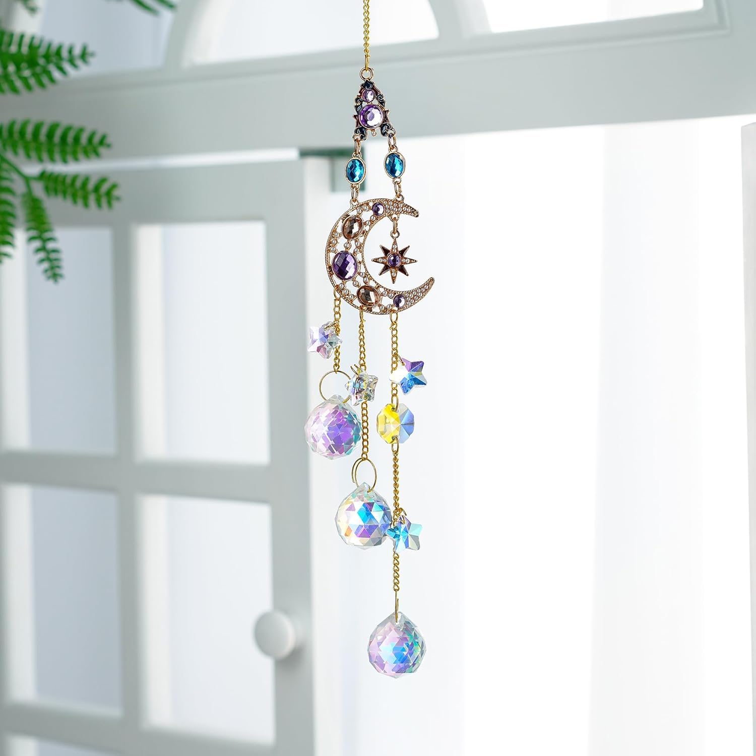 H&D Hyaline & Dora indoor outdoor decor catches sunlight with shimmering rainbow prisms.