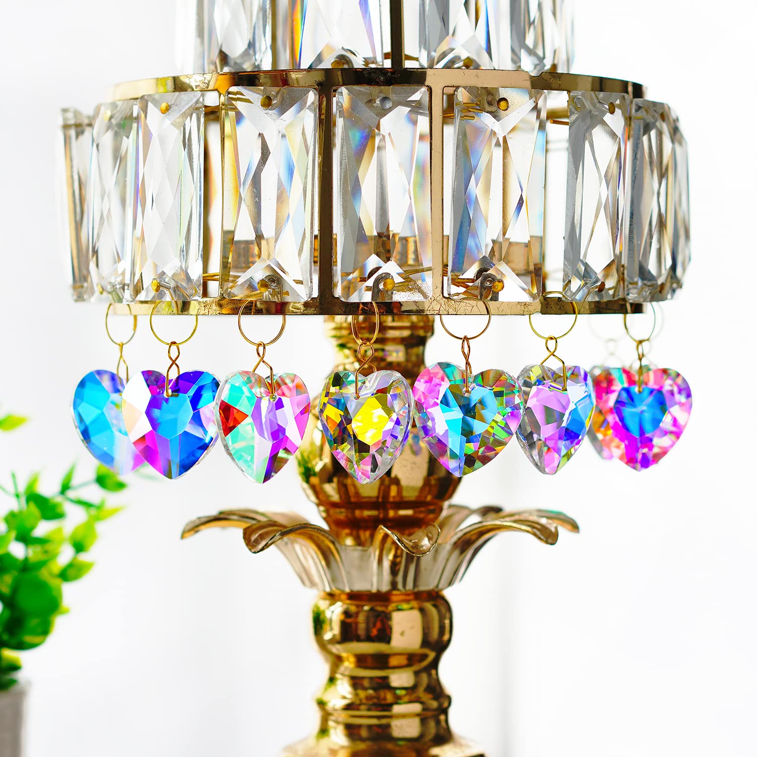 H&D HYALINE & DORA rainbow-prism heart highlighting blues and pinks on sunny days.