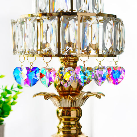 H&D HYALINE & DORA rainbow-prism heart highlighting blues and pinks on sunny days.