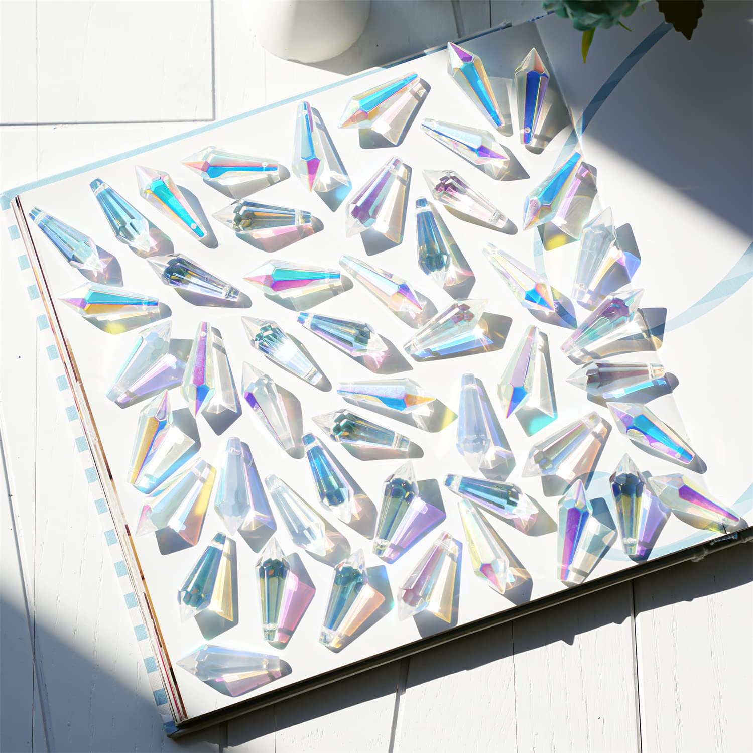 H&D Hyaline & Dora AB-coated icicle prism adds shimmering color to chandeliers.