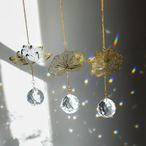 H&D HYALINE & DORA lotus leaf suncatcher pendant catching sunlight through a window