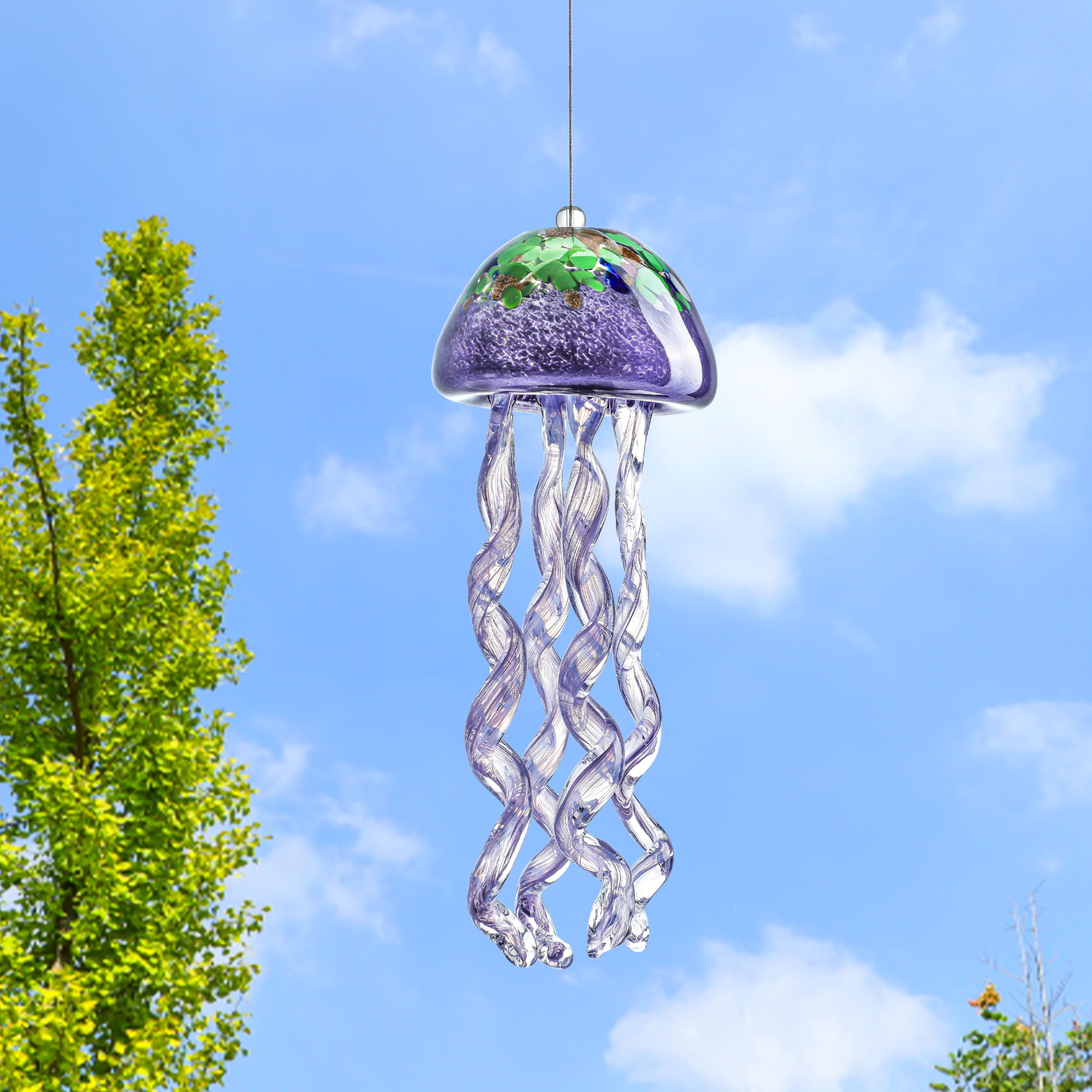 H&D Hyaline and Dora vibrant art-glass purple jellyfish enhances garden focal point.