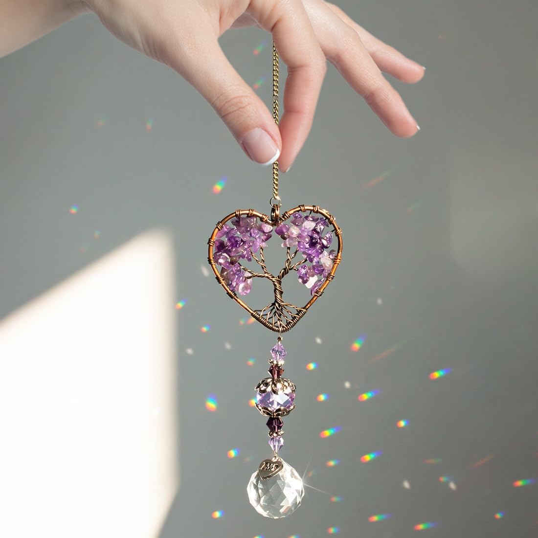 H&D Hyaline & Dora window hanging ornament catching sunlight