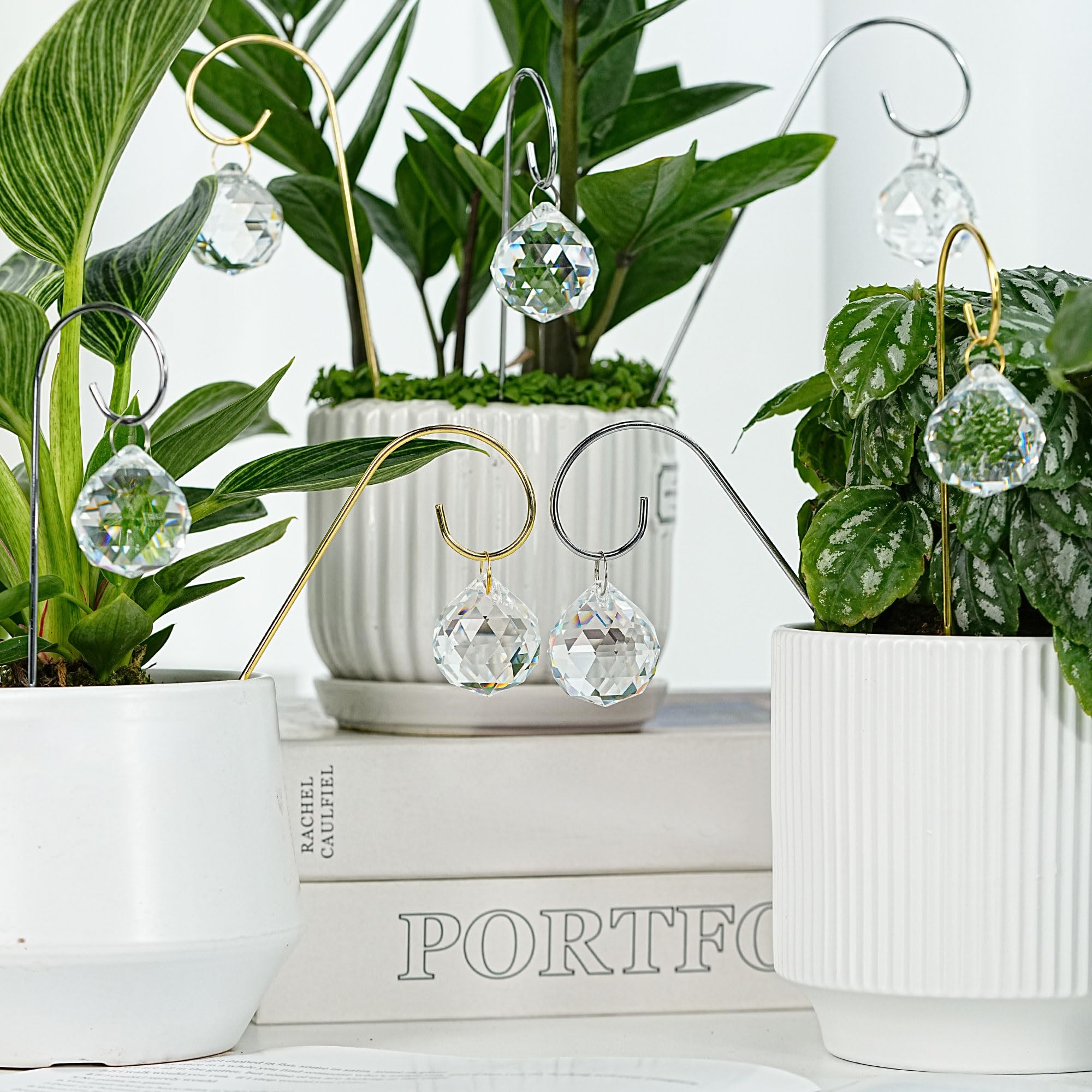 HDCRYSTALGIFTS suncatchers illuminating a garden shelf in sunlight