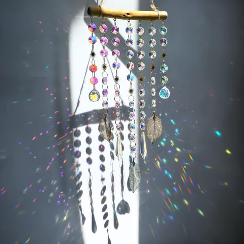 HDCRYSTALGIFTS 13-inch hanging window suncatcher creates rainbow reflections in sunlight.
