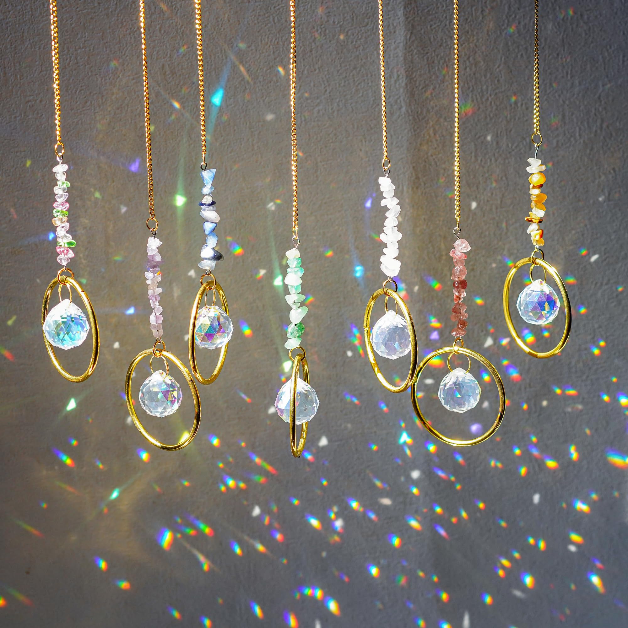 HDCRYSTALGIFTS seven crystal suncatchers create vivid rainbows in sunlight.