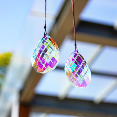 HDCRYSTALGIFTS sun catcher in garden adds elegant color and shimmer.