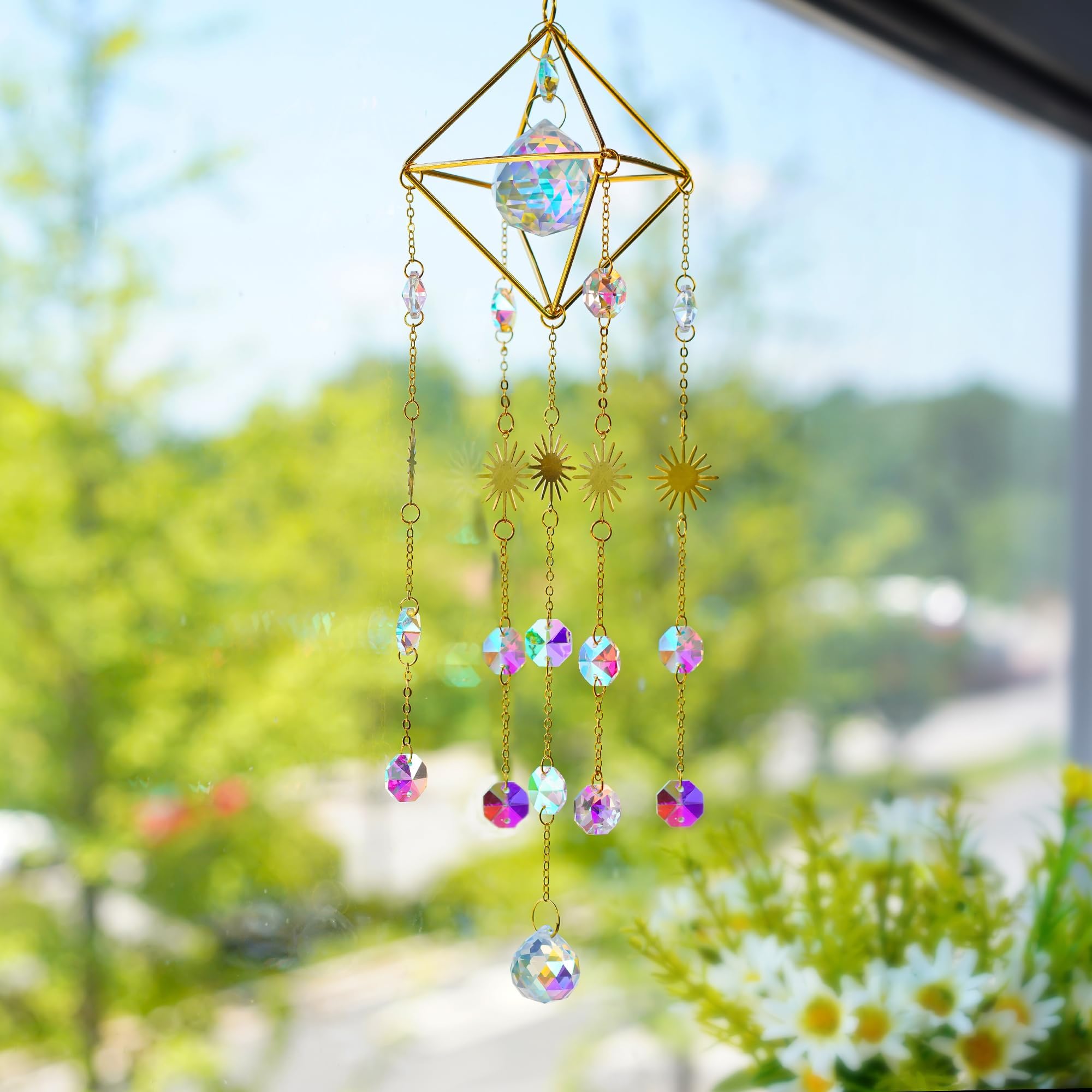 HDCRYSTALGIFTS crystal suncatcher brightening indoor and outdoor spaces near plants.