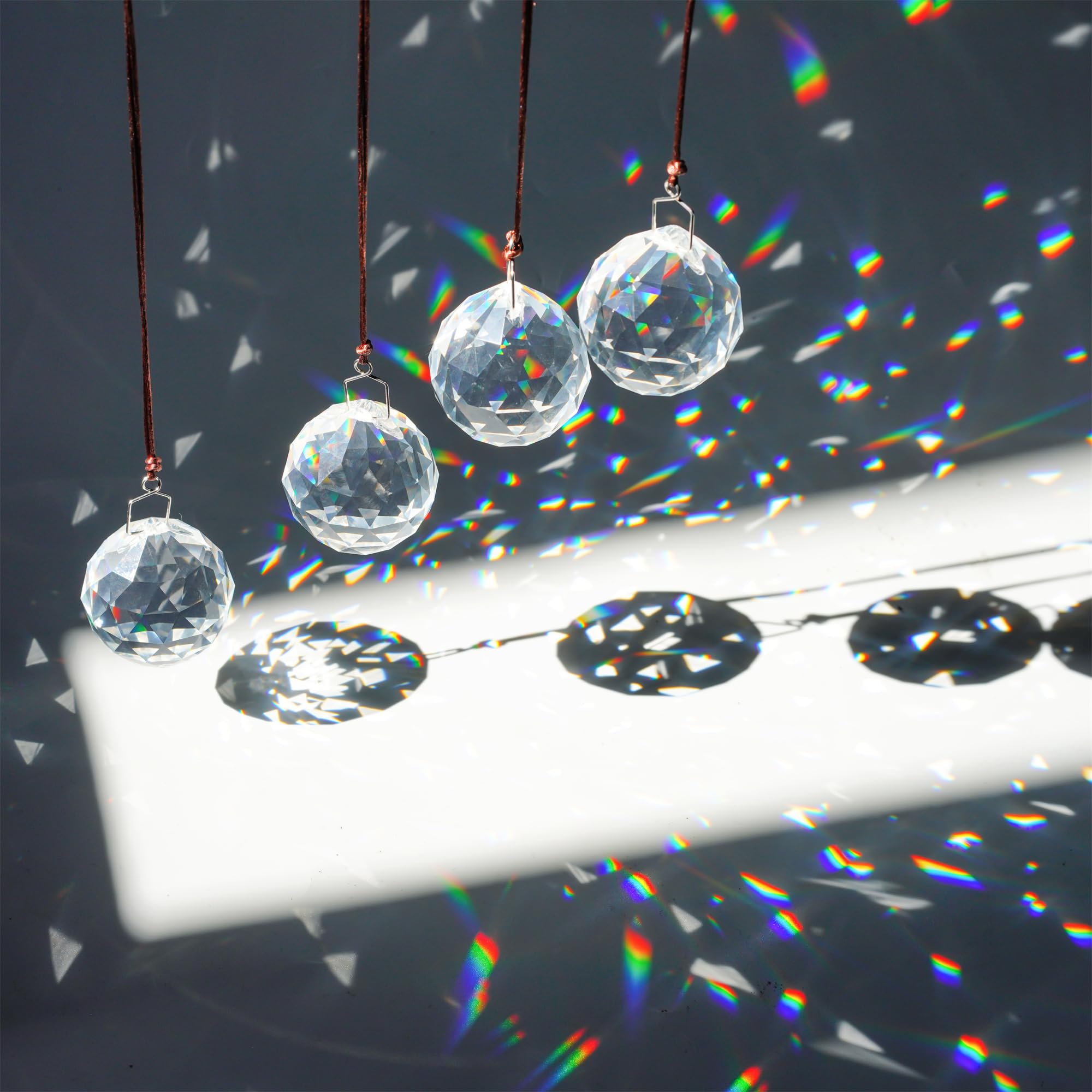 HDCRYSTALGIFTS rainbow prism ball hanging adds vibrant light to windows.