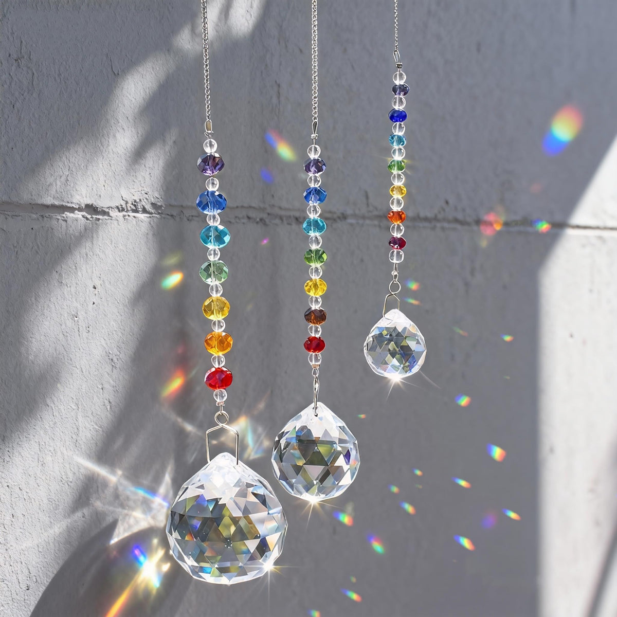 HDCRYSTALGIFTS crystal prism suncatchers shimmer in windows, creating vibrant rainbow light.