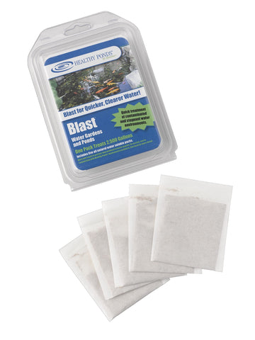Healthy Ponds Blast packets dissolving in pond water for clearer, healthier ponds.