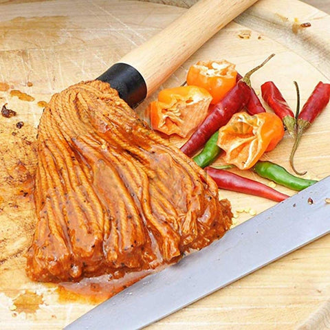 Dishwasher-safe mop head simplifies cleanup after grilling.