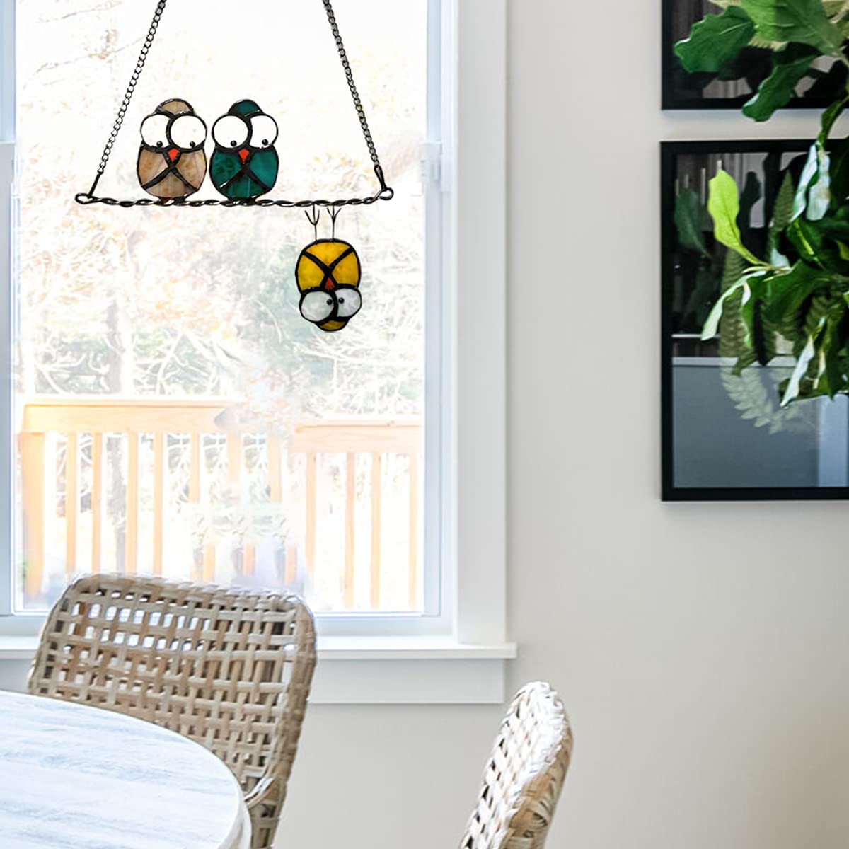Hedyaner owl on wire hanging in window adds bright seasonal ambience