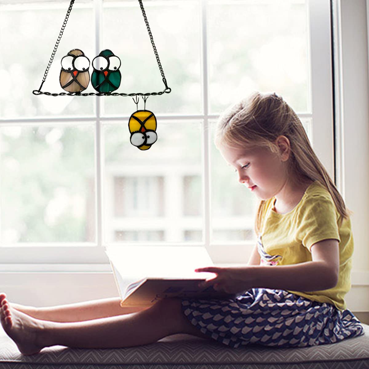 Hedyaner suncatcher in kitchen window invites natural light play
