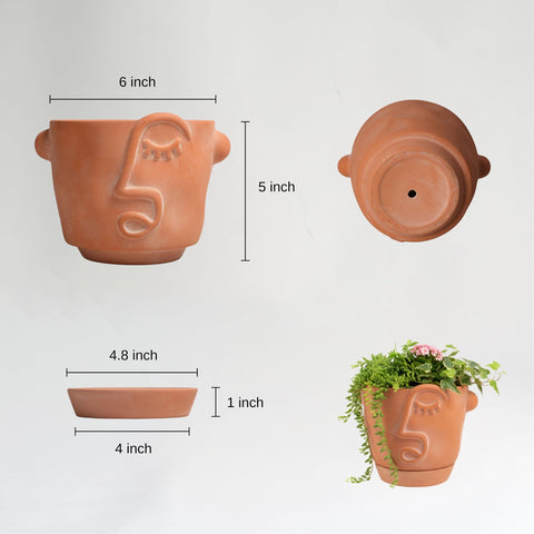 HERDUK abstract face planter close-up showing drainage hole and saucer