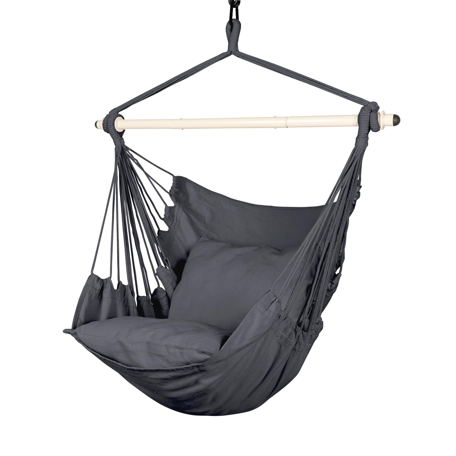Highwild hammock chair hangs from a tree branch for easy outdoor relaxation.