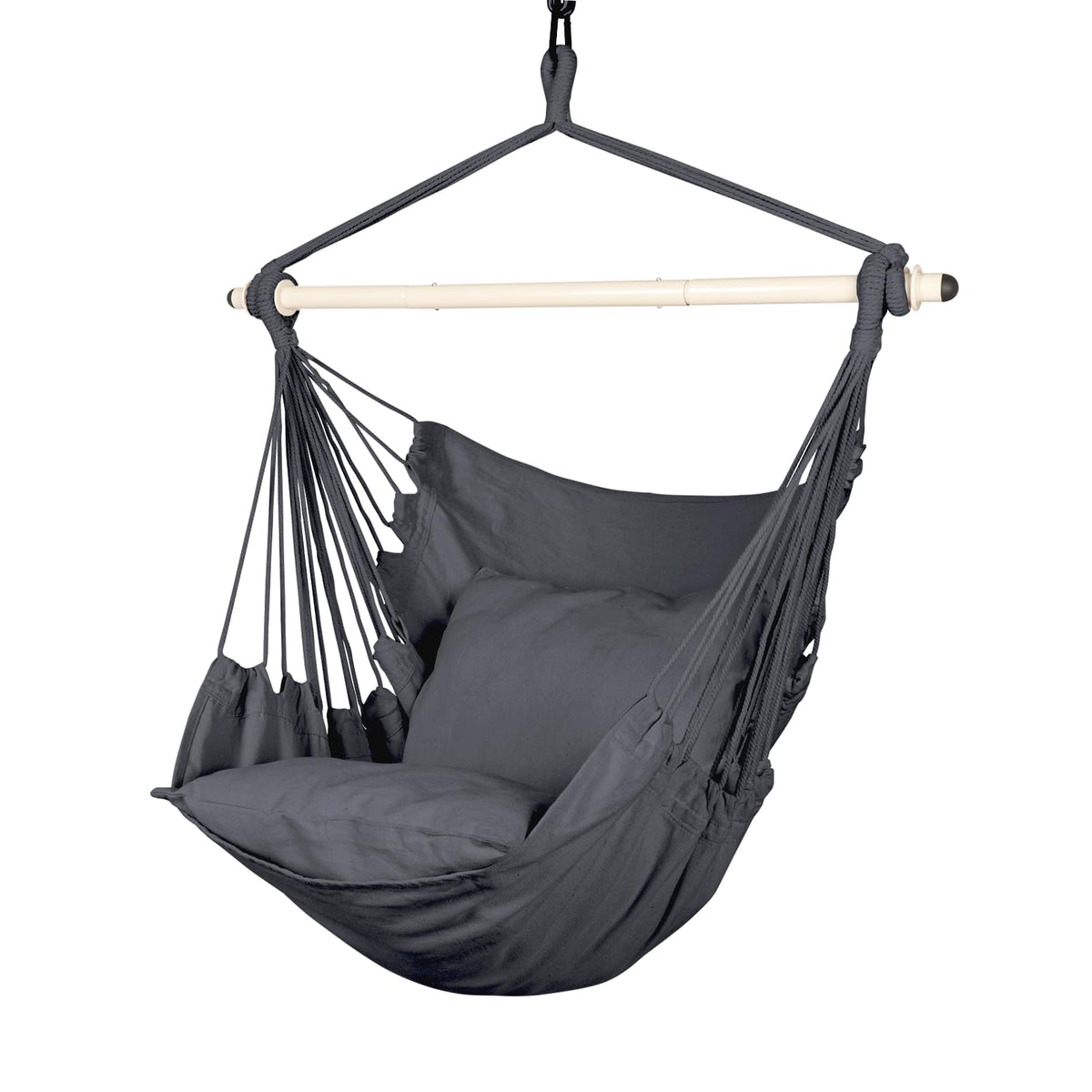 Highwild hammock chair hangs from a tree branch for easy outdoor relaxation.