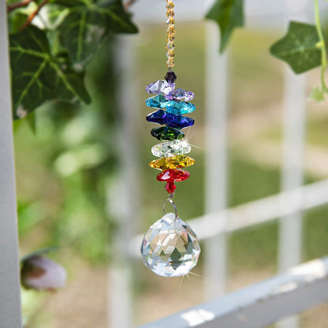 H&D Hyaline & Dora 30mm crystal ball reflects sunlight into rainbow specks.